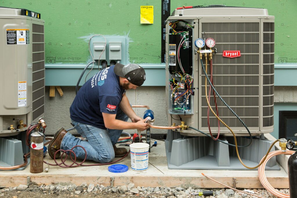 HVAC technician repairs a Bryant AC unit in West Chester, PA. Air conditioning service and maintenance by expert technicians.